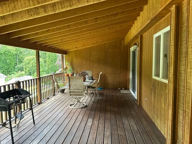 a wooden bench sitting in the middle of a park