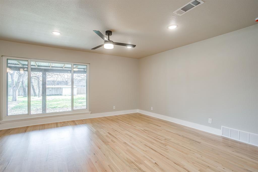 103 Vanshire Road West Lakeside, TX 76108 - Photo 15 of 39 an empty room with wooden floor fan and windows