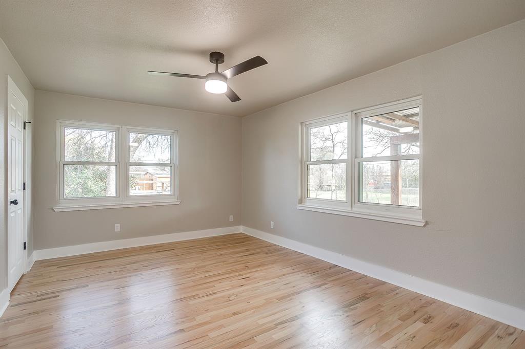 103 Vanshire Road West Lakeside, TX 76108 - Photo 25 of 39 a view of an empty room with wooden floor and a window
