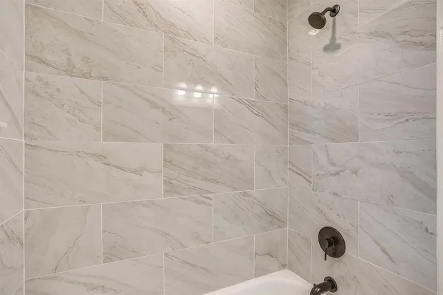 a bathroom with a granite shower