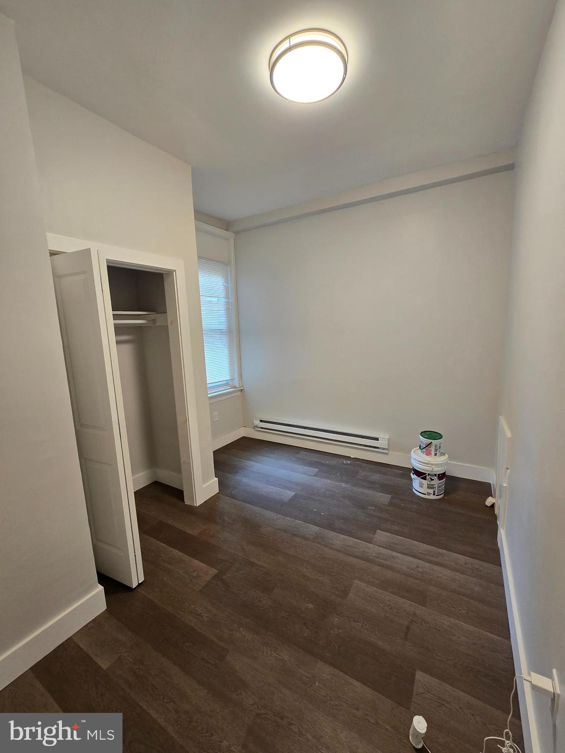 1321 West Wingohocking Street, Unit 1 Philadelphia, PA 19140 - Photo 15 of 19 an empty room with wooden floor and closet