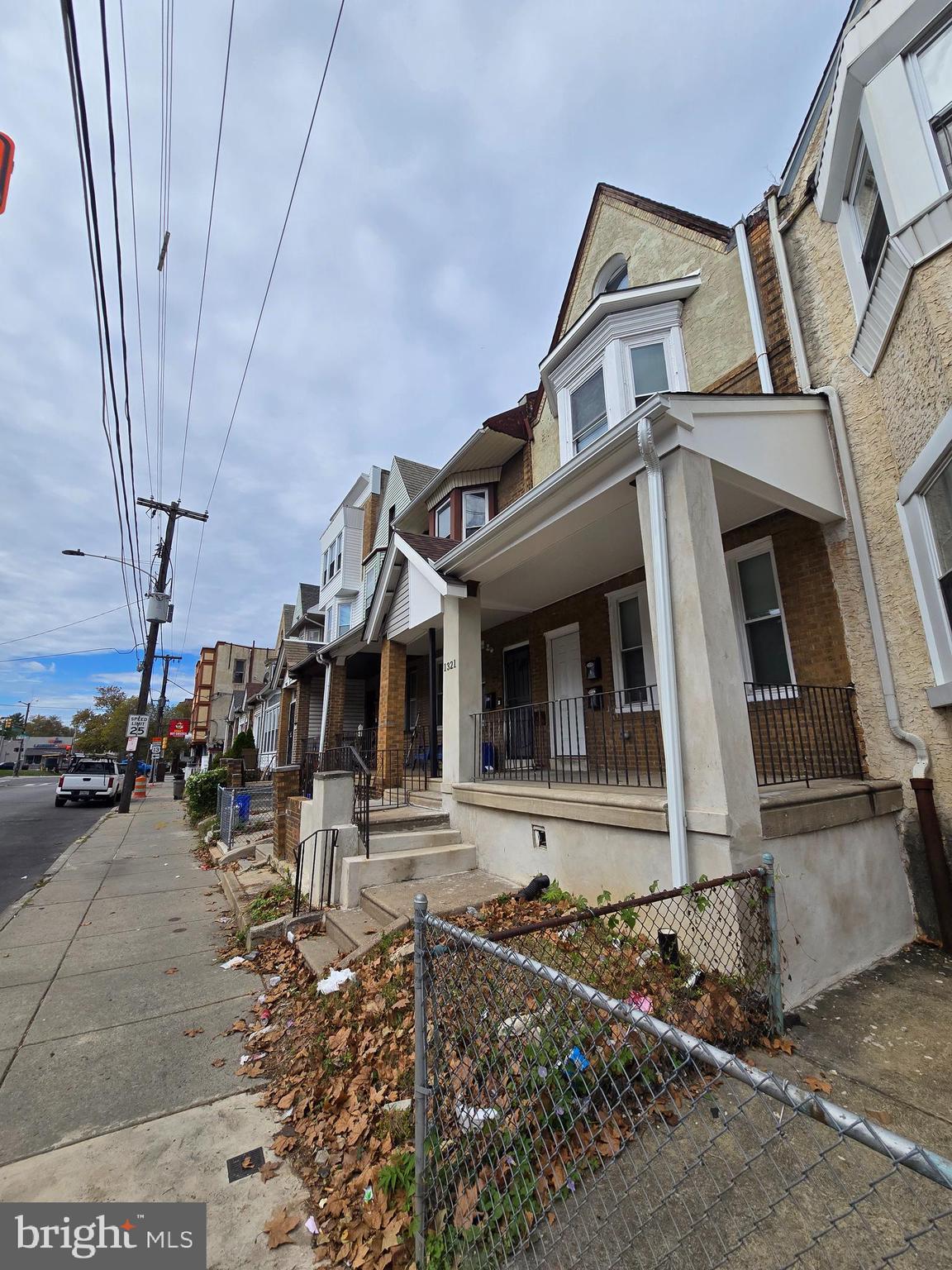 1321 West Wingohocking Street, Unit 1 Philadelphia, PA 19140 - Photo 3 of 19 a front view of a house with garage