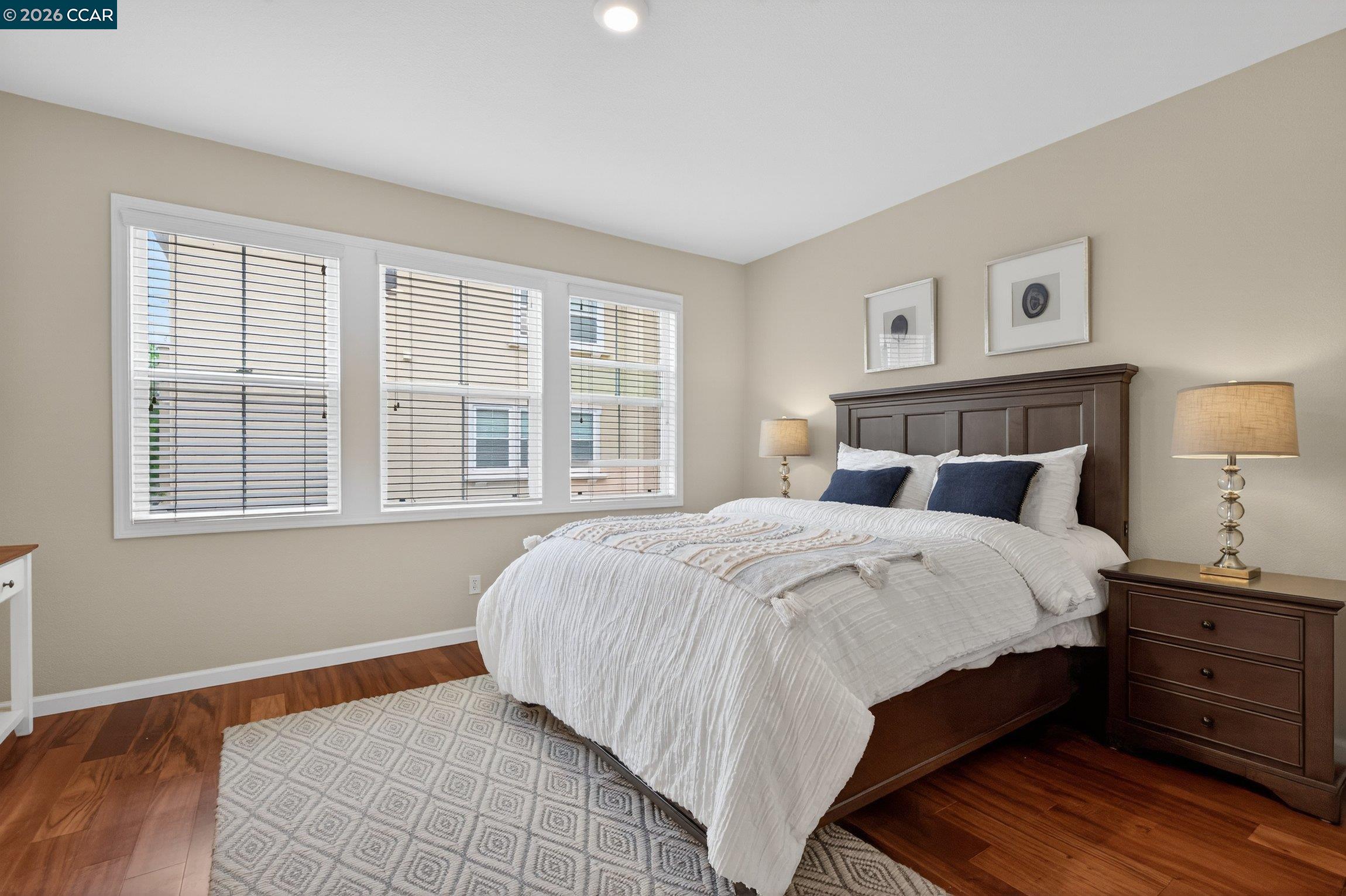 4300 Keegan Street Dublin, CA 94568 - Photo 17 of 33 a bedroom with a bed and wooden floor