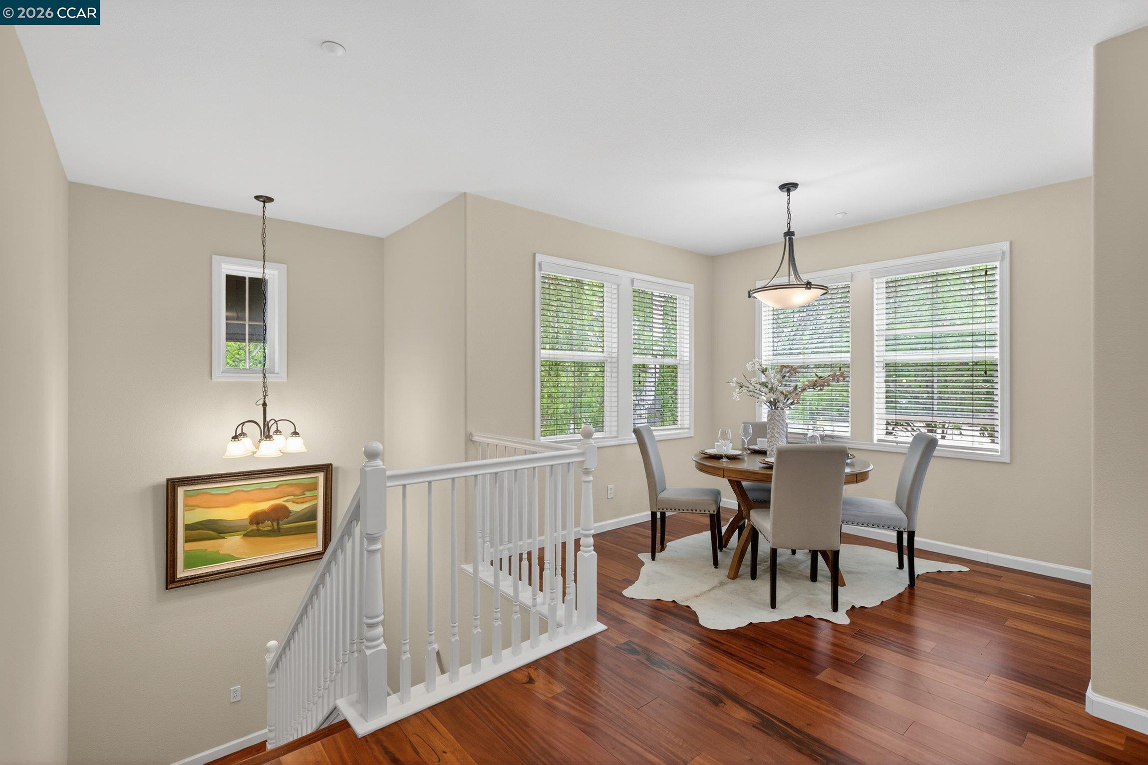 4300 Keegan Street Dublin, CA 94568 - Photo 5 of 33 a view of a dining room with furniture a chandelier and wooden floor