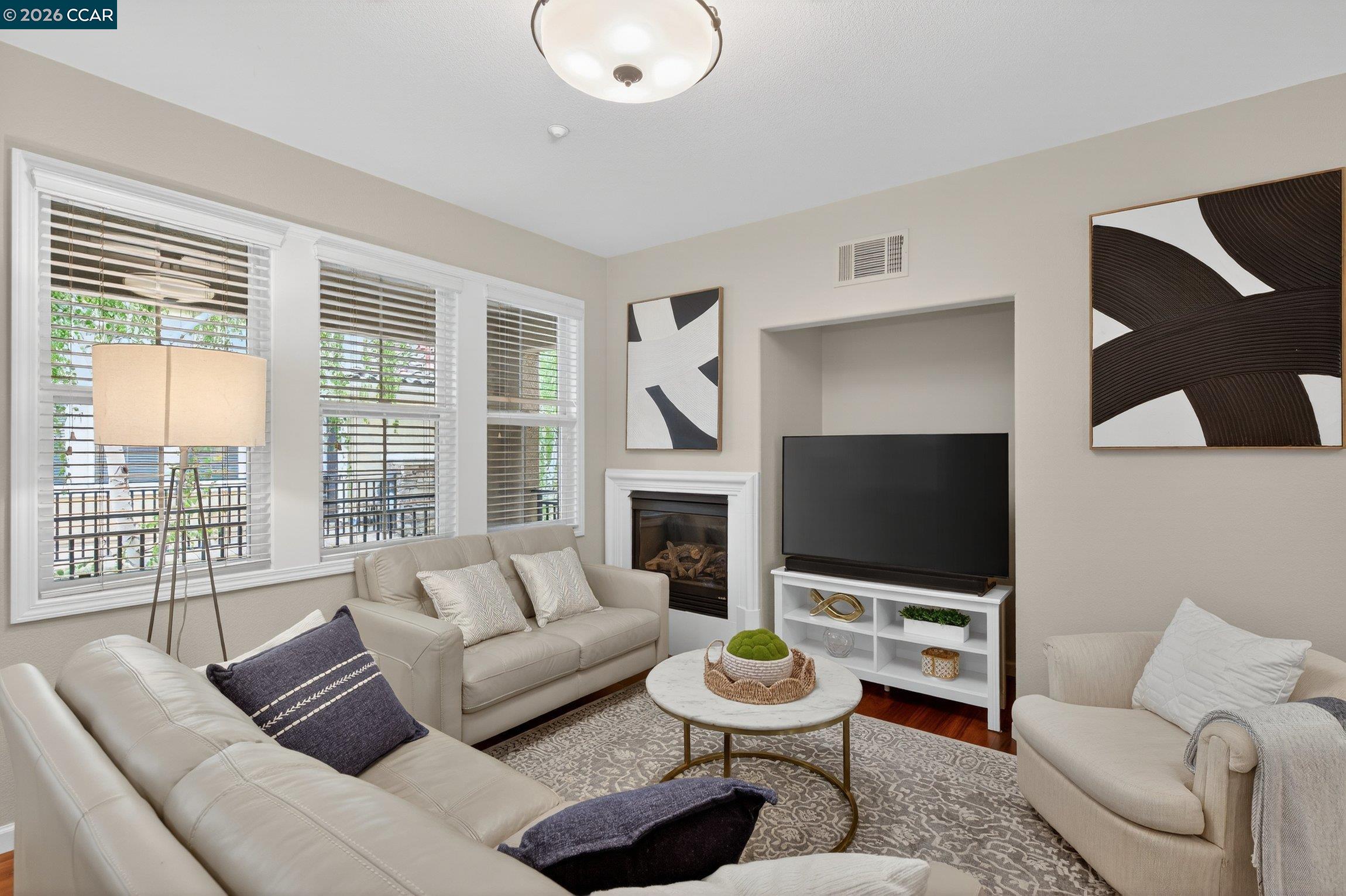 4300 Keegan Street Dublin, CA 94568 - Photo 10 of 33 a living room with furniture a fireplace and a flat screen tv