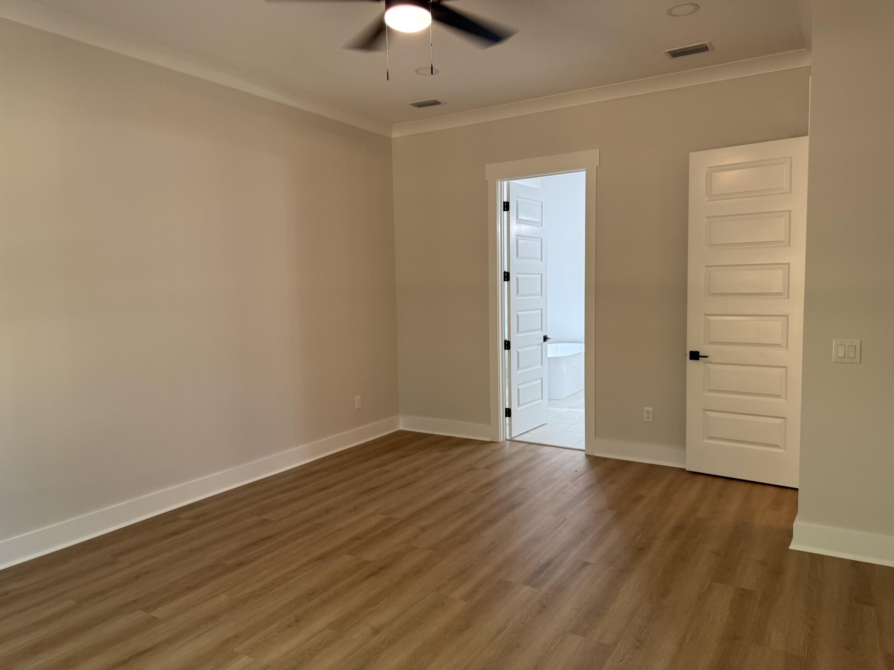 246 Foxglove Run Niceville, FL 32578 - Photo 19 of 40 wooden floor in an empty room