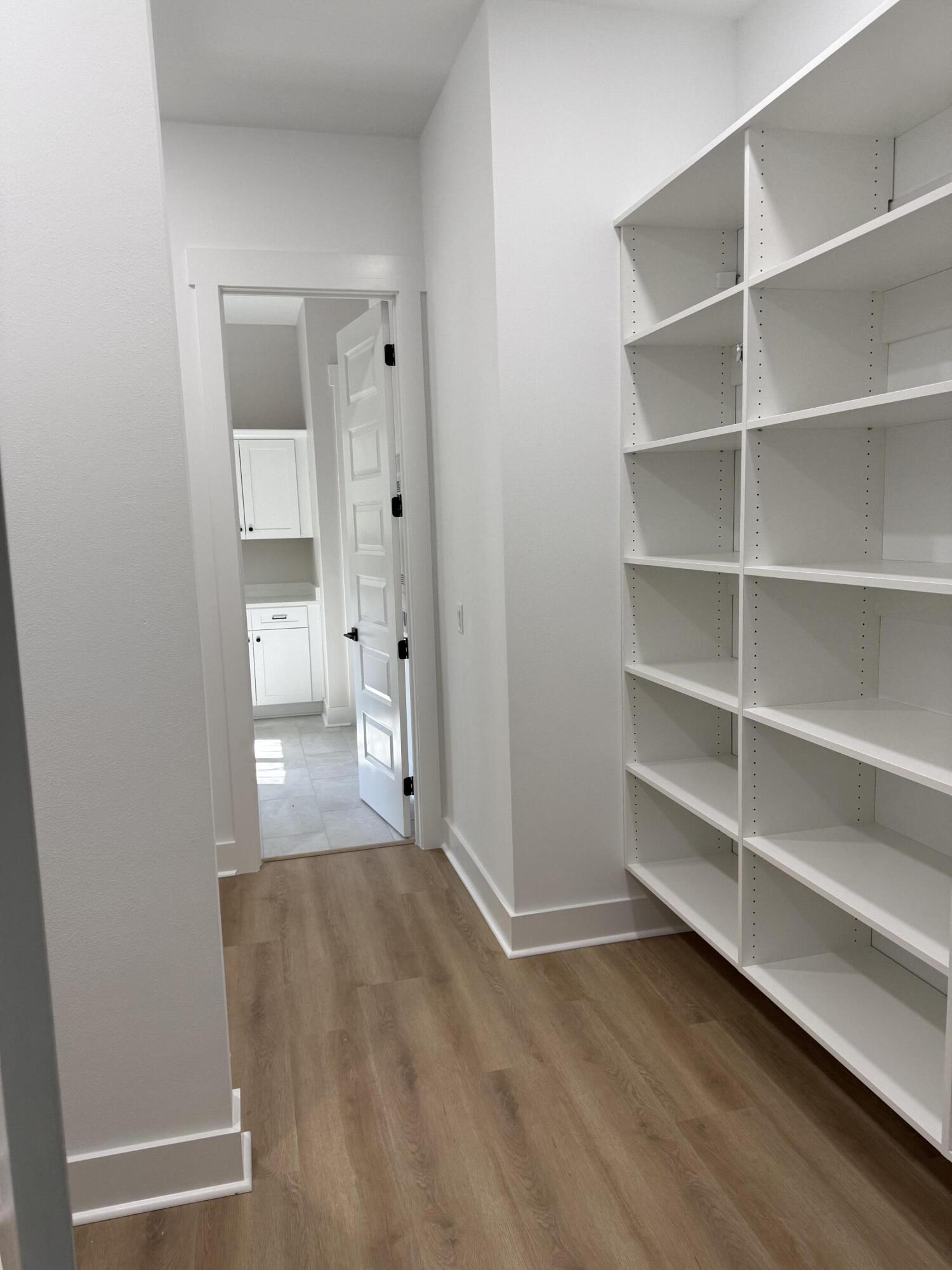 246 Foxglove Run Niceville, FL 32578 - Photo 25 of 40 a view of a hallway with wooden floor and closet