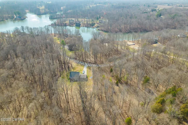 a aerial view of a house with a lake view
