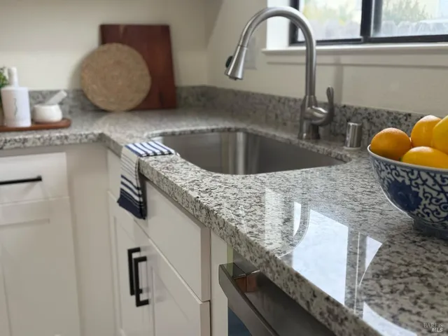 a stove top oven sitting inside of a kitchen