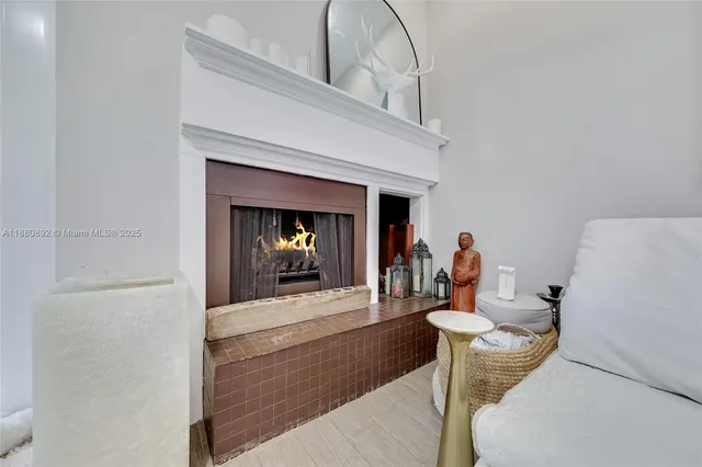 a dining room with furniture and a fireplace