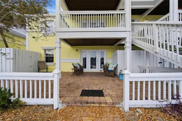 a view of a house with wooden deck