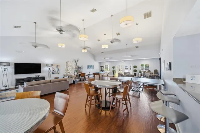 a view of a dining room with furniture and wooden floor