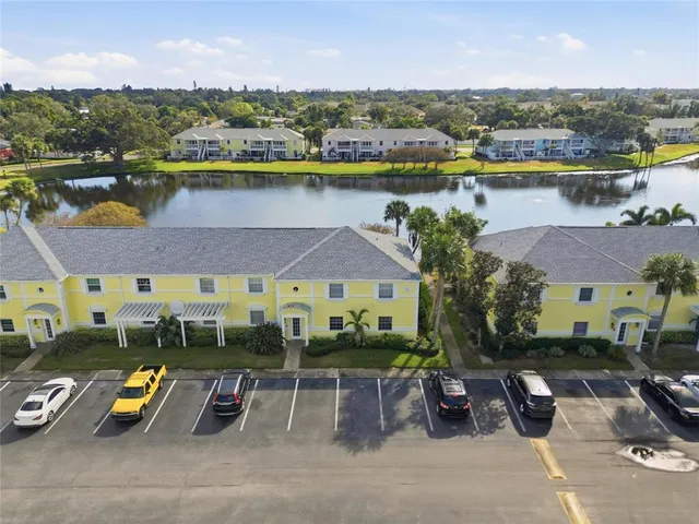 an aerial view of a yard with swimming pool and outdoor seating