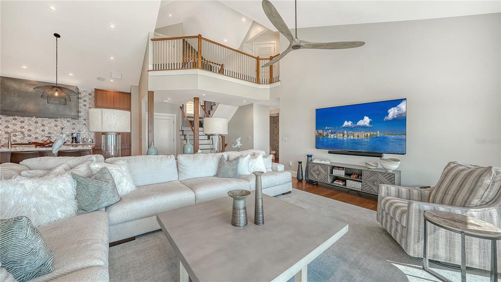 95 52nd Street Holmes Beach, FL 34217 - Photo 11 of 73 a living room with furniture and a flat screen tv