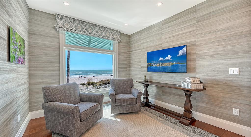 95 52nd Street Holmes Beach, FL 34217 - Photo 22 of 73 a living room with furniture and a wall painting