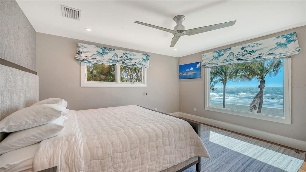 95 52nd Street Holmes Beach, FL 34217 - Photo 30 of 73 a bedroom with a large bed and a window