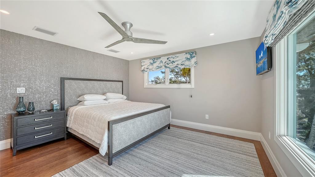 95 52nd Street Holmes Beach, FL 34217 - Photo 31 of 73 a bedroom with a bed and a window