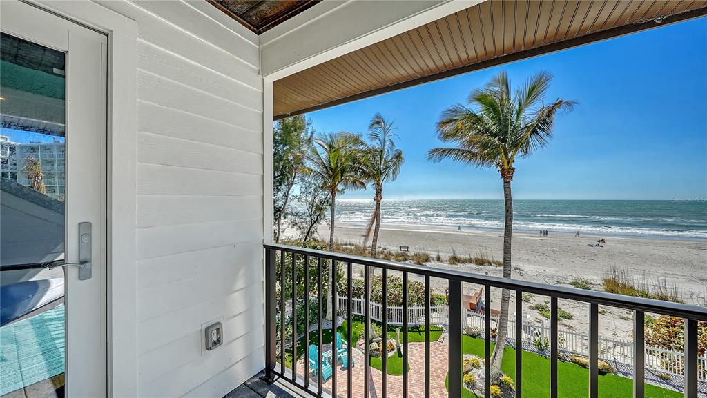 95 52nd Street Holmes Beach, FL 34217 - Photo 36 of 73 a view of a palm tree from a balcony