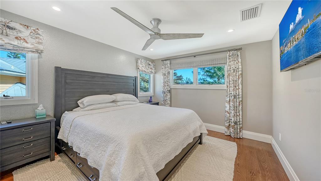 95 52nd Street Holmes Beach, FL 34217 - Photo 37 of 73 a bedroom with a bed and a window
