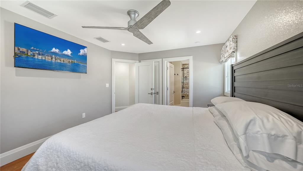 95 52nd Street Holmes Beach, FL 34217 - Photo 39 of 73 a bedroom with a large bed