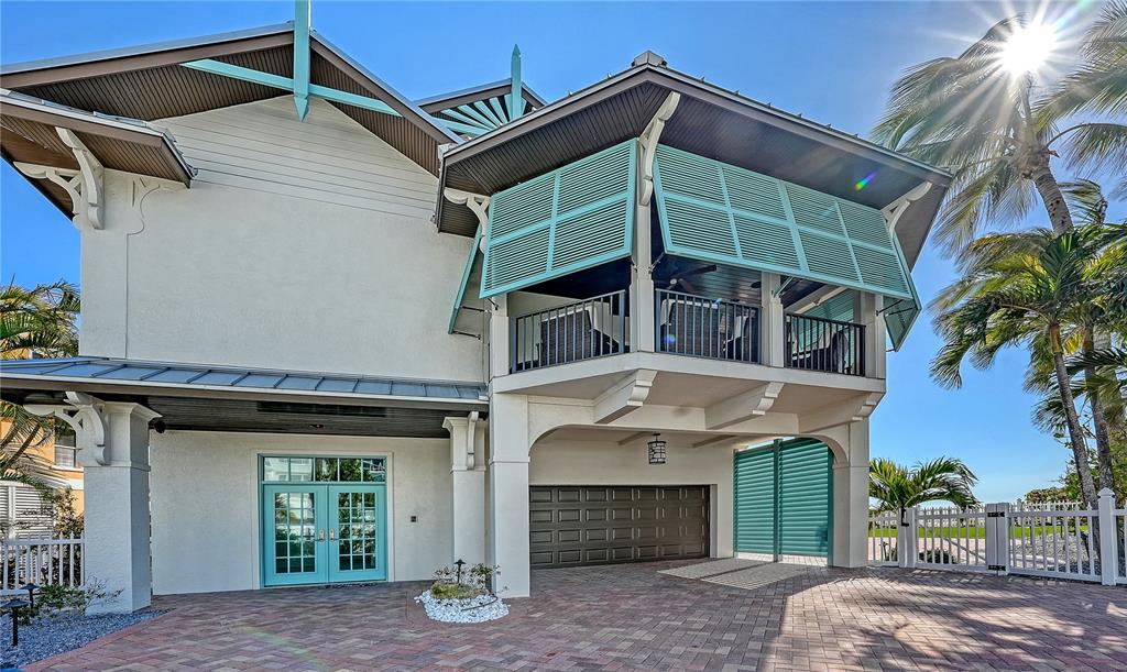 95 52nd Street Holmes Beach, FL 34217 - Photo 4 of 73 a view of a house with a balcony and entryway