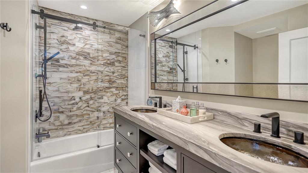 95 52nd Street Holmes Beach, FL 34217 - Photo 41 of 73 a bathroom with a sink and a mirror