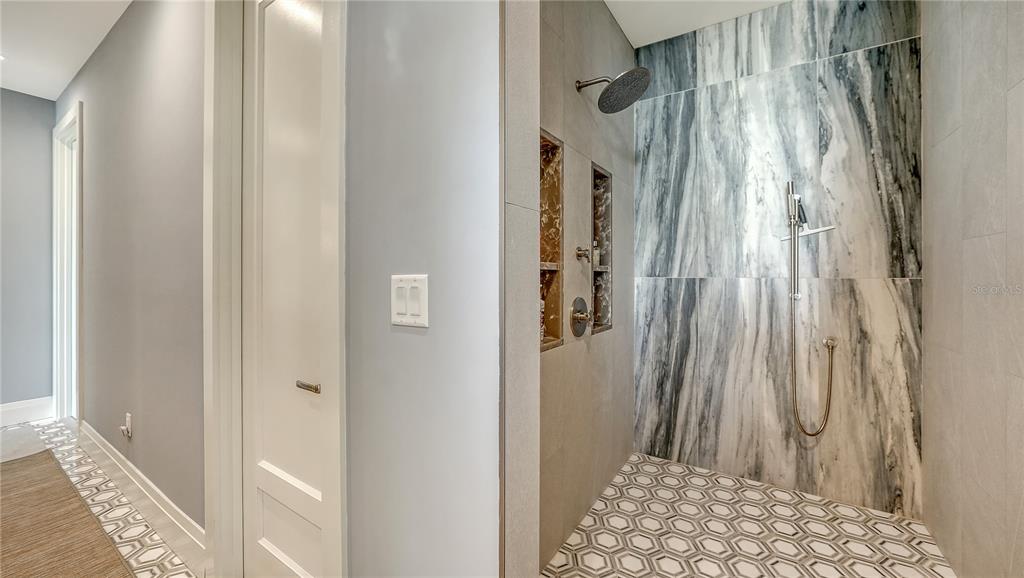 95 52nd Street Holmes Beach, FL 34217 - Photo 44 of 73 a view of a bathroom with a shower curtain