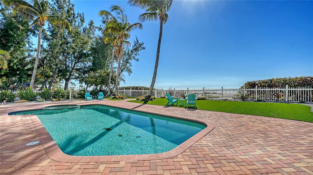 95 52nd Street Holmes Beach, FL 34217 - Photo 54 of 73 a view of a backyard with swimming pool