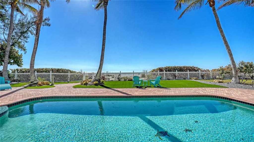 95 52nd Street Holmes Beach, FL 34217 - Photo 55 of 73 a view of an outdoor space and swimming pool