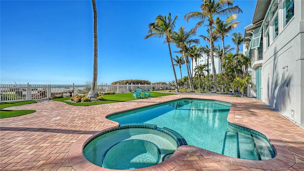 95 52nd Street Holmes Beach, FL 34217 - Photo 57 of 73 a view of a swimming pool with a yard