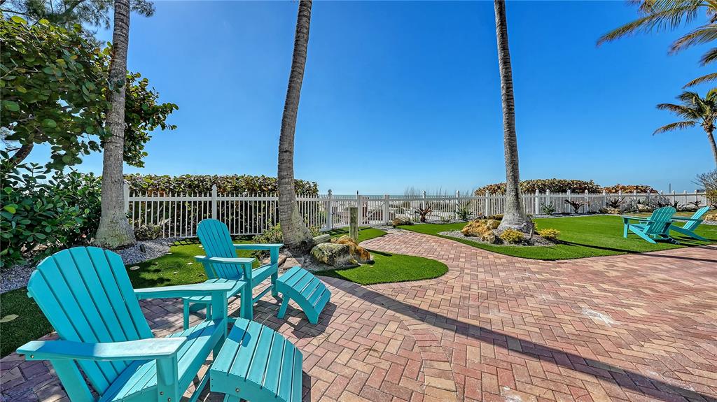 95 52nd Street Holmes Beach, FL 34217 - Photo 59 of 73 a view of a chairs and table in patio