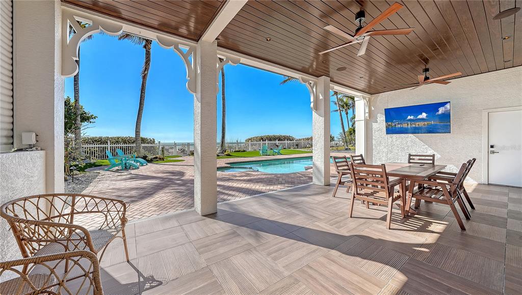 95 52nd Street Holmes Beach, FL 34217 - Photo 60 of 73 a view of a patio with a table and chairs