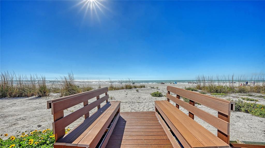 95 52nd Street Holmes Beach, FL 34217 - Photo 68 of 73 a view of a balcony with wooden floor and fence