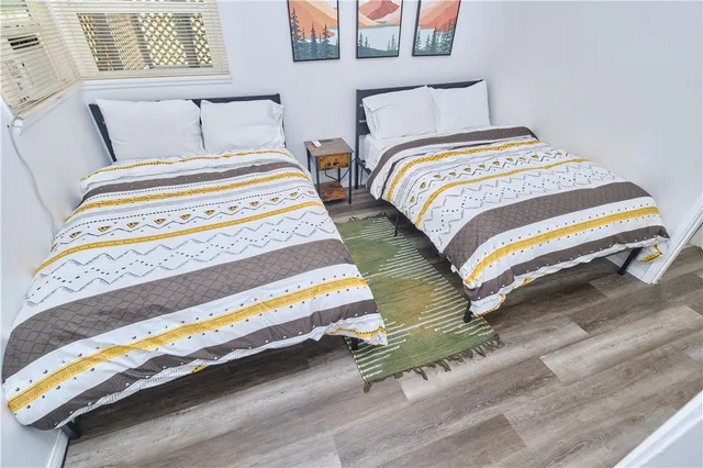 a bedroom with bed and window