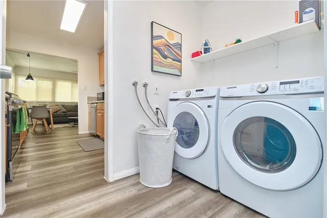 a view of a hallway with washer and dryer