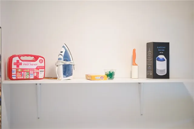 a living room with a couch and a chandelier