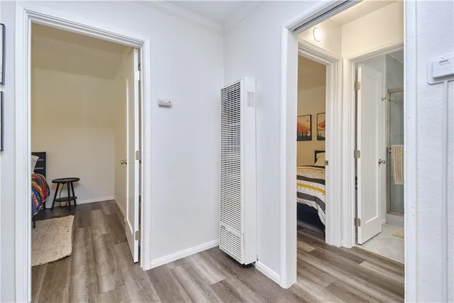 a view of hallway with wooden floor