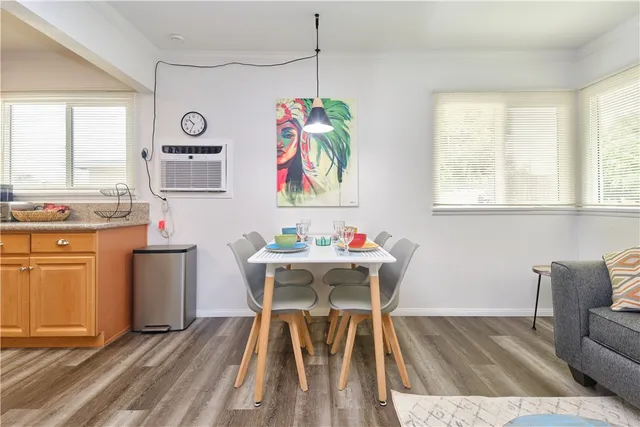 a dining room with furniture and window