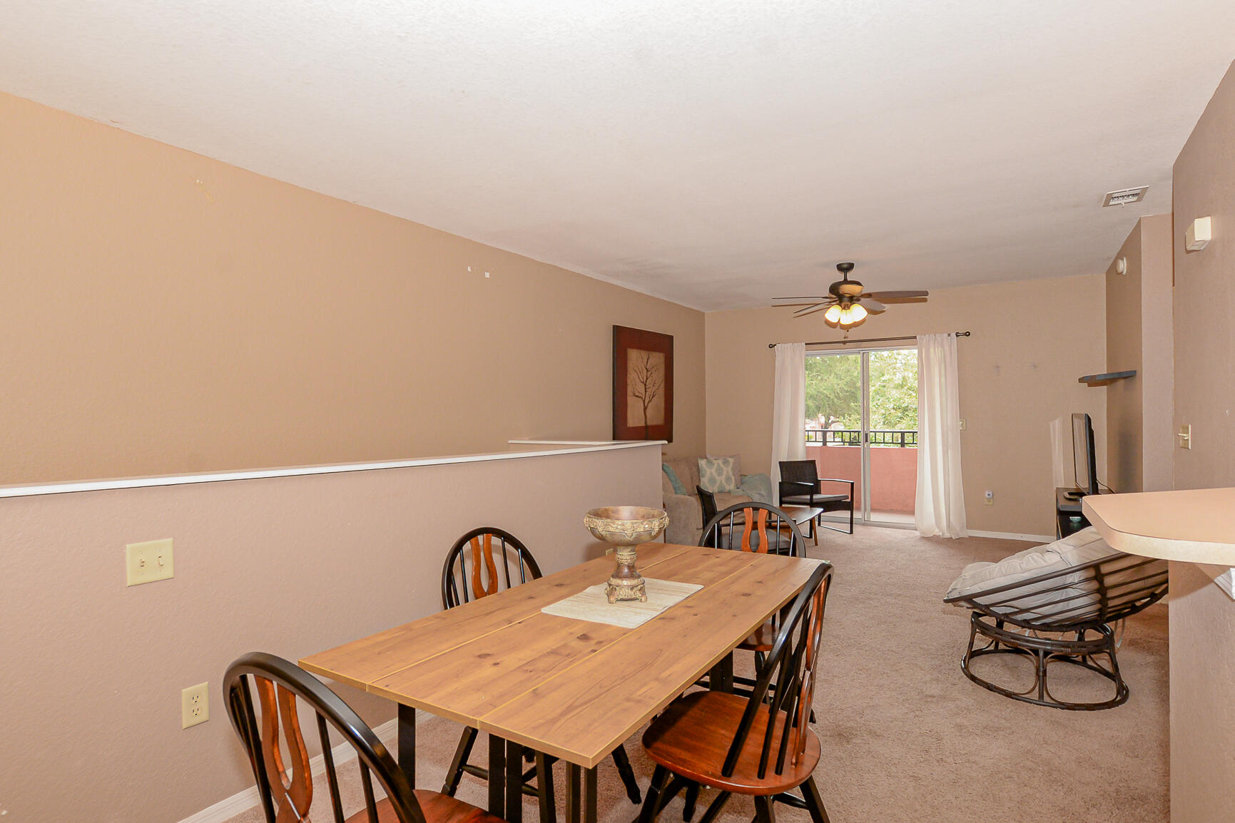 106 Southwest Peacock Boulevard, Unit 4204 Port St. Lucie, FL 34986 - Photo 11 of 47 a view of a dining room with furniture and window
