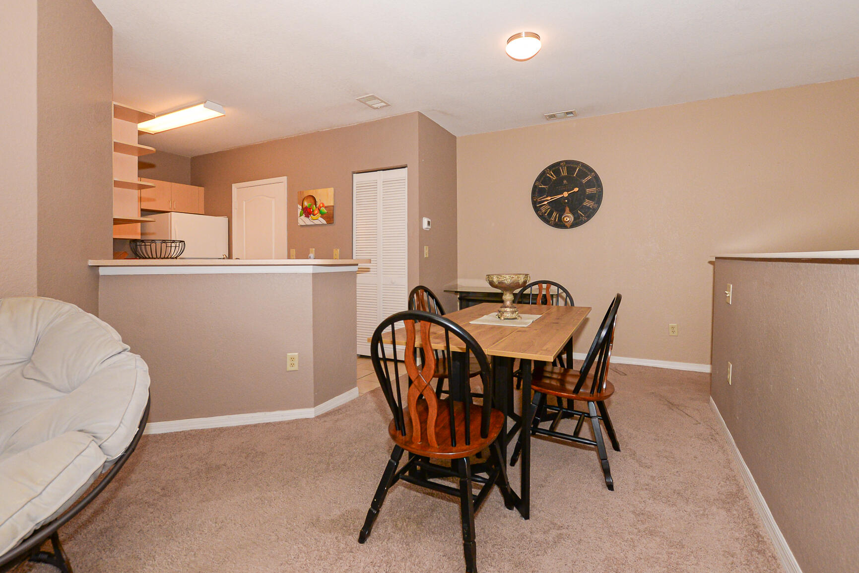 106 Southwest Peacock Boulevard, Unit 4204 Port St. Lucie, FL 34986 - Photo 18 of 47 a dining room with furniture and window