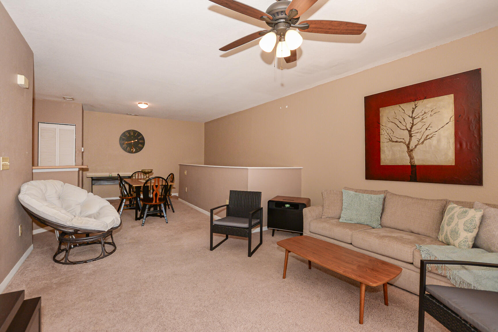106 Southwest Peacock Boulevard, Unit 4204 Port St. Lucie, FL 34986 - Photo 21 of 47 a living room with furniture and a large window