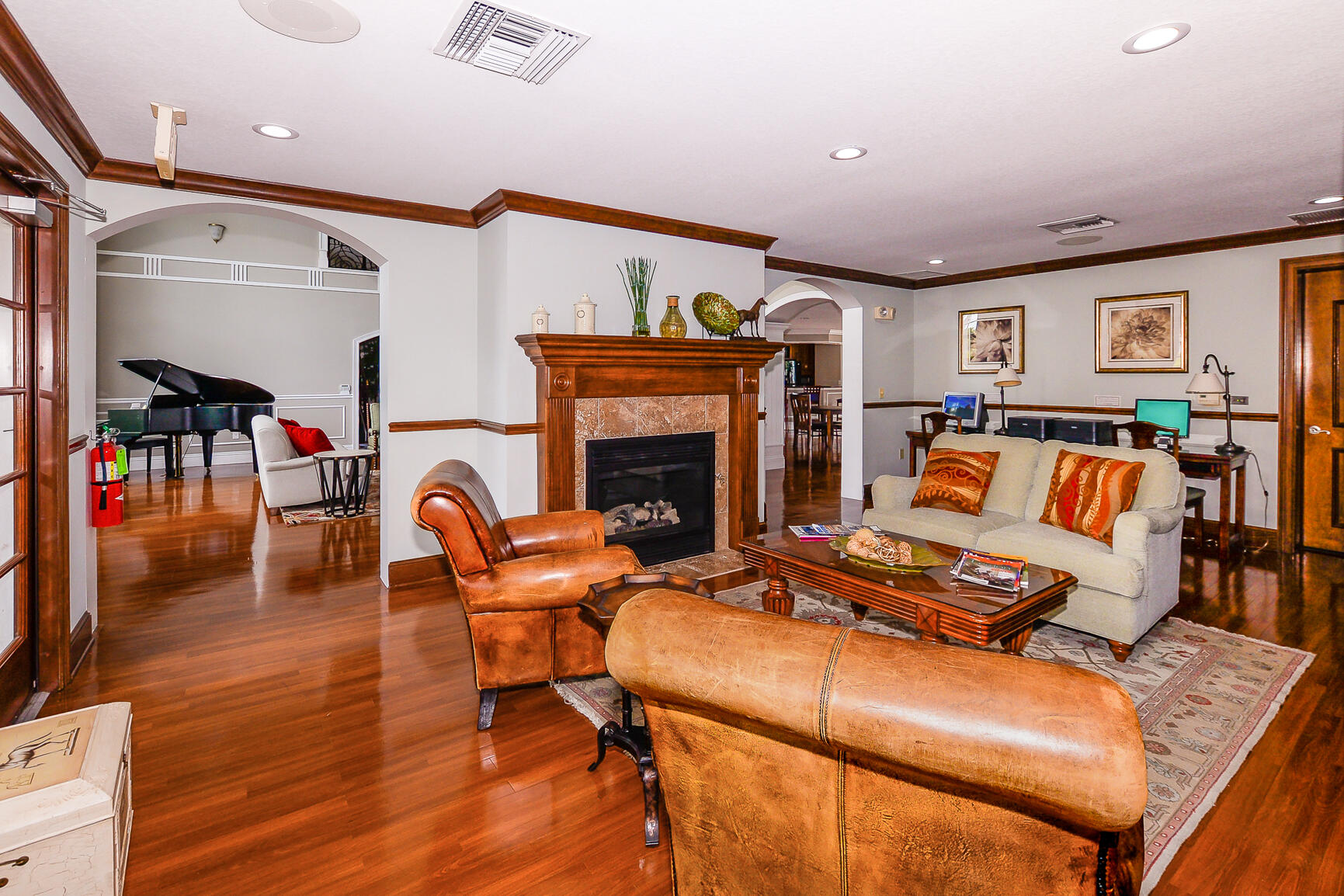 106 Southwest Peacock Boulevard, Unit 4204 Port St. Lucie, FL 34986 - Photo 38 of 47 a living room with furniture and a fireplace