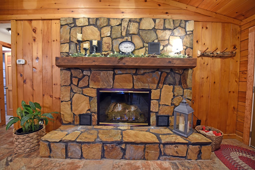 90 Log Cabin Road Blairsville, GA 30512 - Photo 11 of 45 a living room with furniture and a fireplace