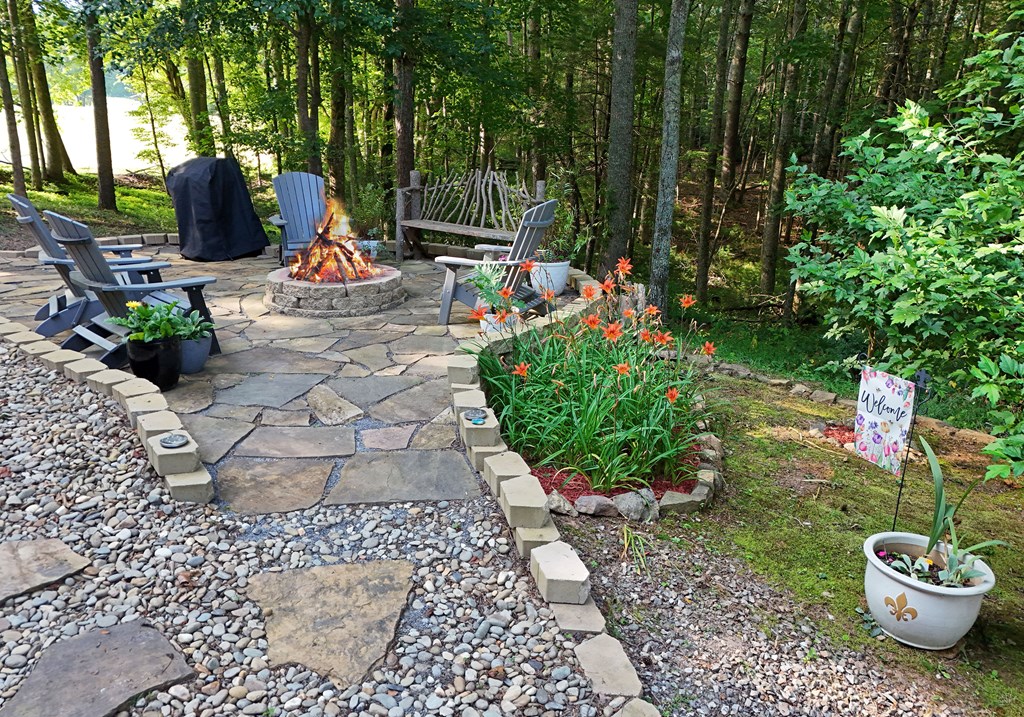 90 Log Cabin Road Blairsville, GA 30512 - Photo 30 of 45 a view of a patio with chairs and plants