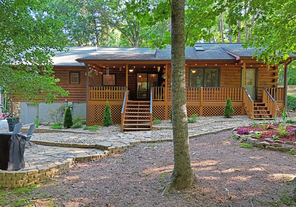90 Log Cabin Road Blairsville, GA 30512 - Photo 33 of 45 a front view of a house with garden