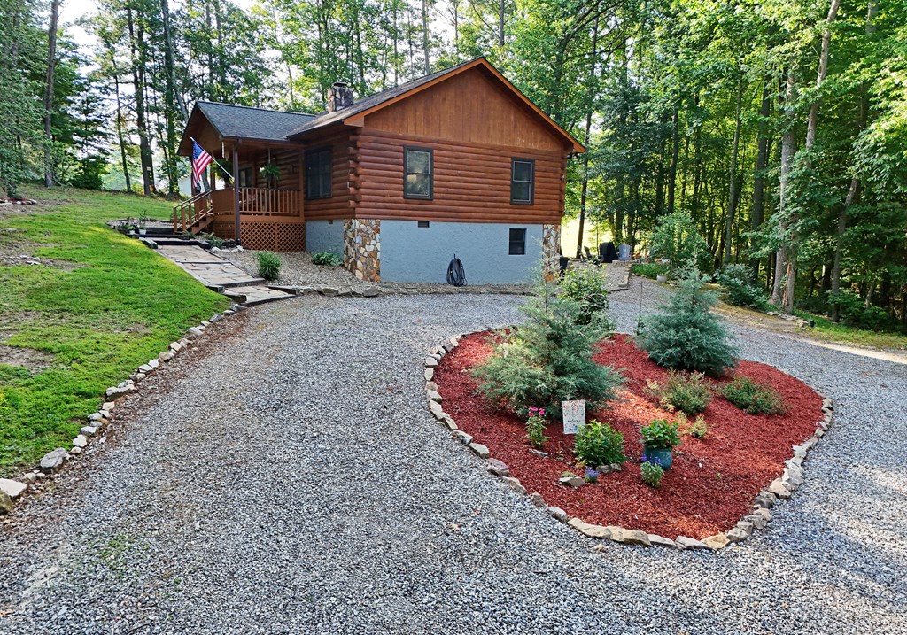 90 Log Cabin Road Blairsville, GA 30512 - Photo 4 of 45 a front view of house with a garden