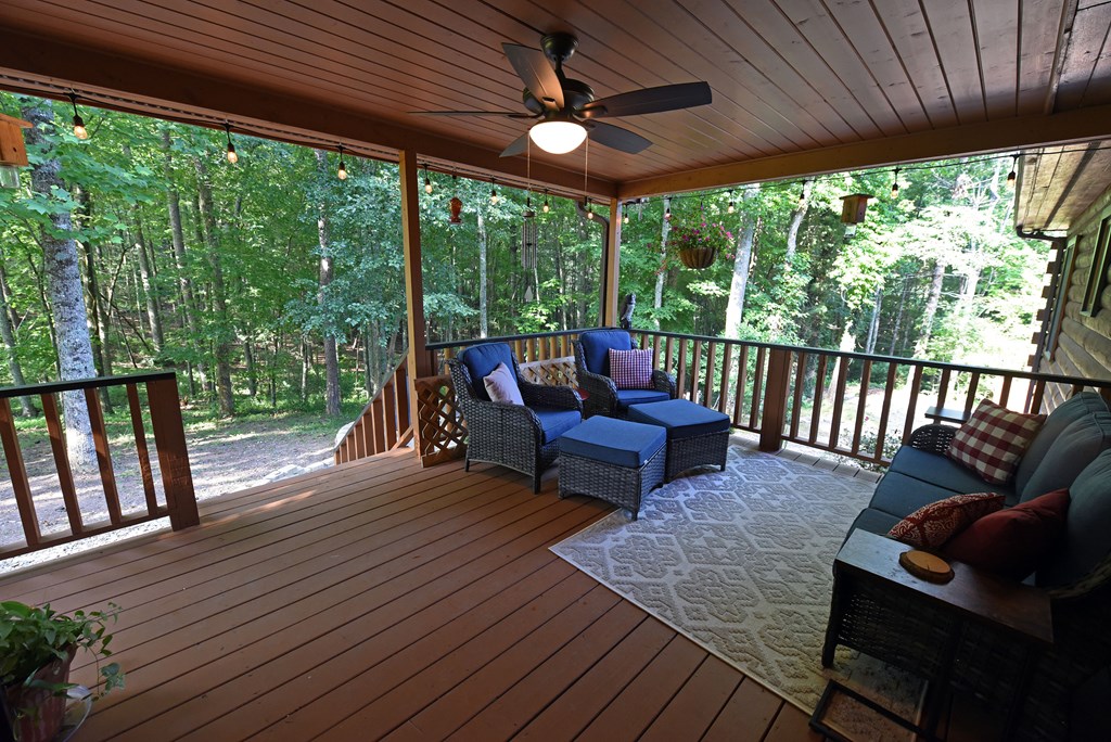 90 Log Cabin Road Blairsville, GA 30512 - Photo 42 of 45 a living room with furniture and a floor to ceiling window