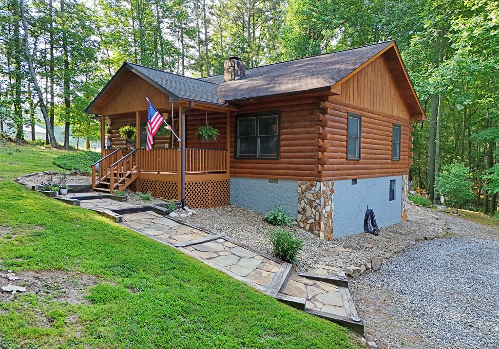 90 Log Cabin Road Blairsville, GA 30512 - Photo 5 of 45 a view of an house with backyard space and garden