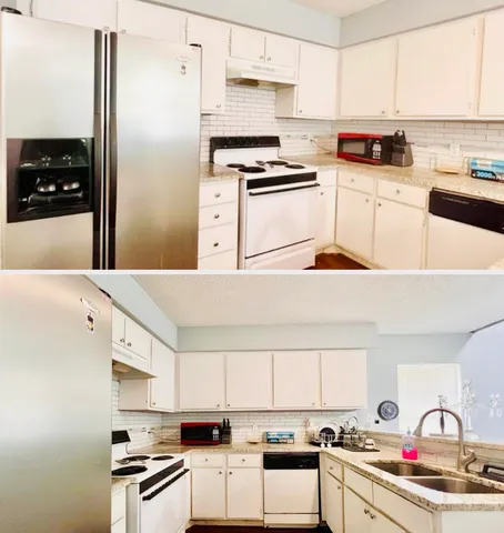 a kitchen with stainless steel appliances kitchen island wooden cabinets a stove a sink and white cabinets