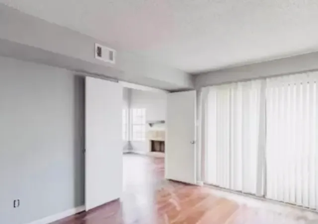 a view of a kitchen with a sink and a window